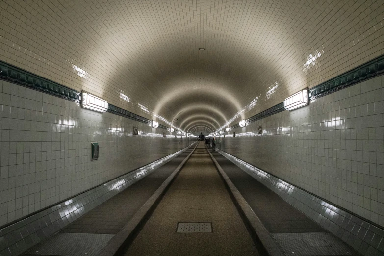 a long train station that is next to some subway tracks