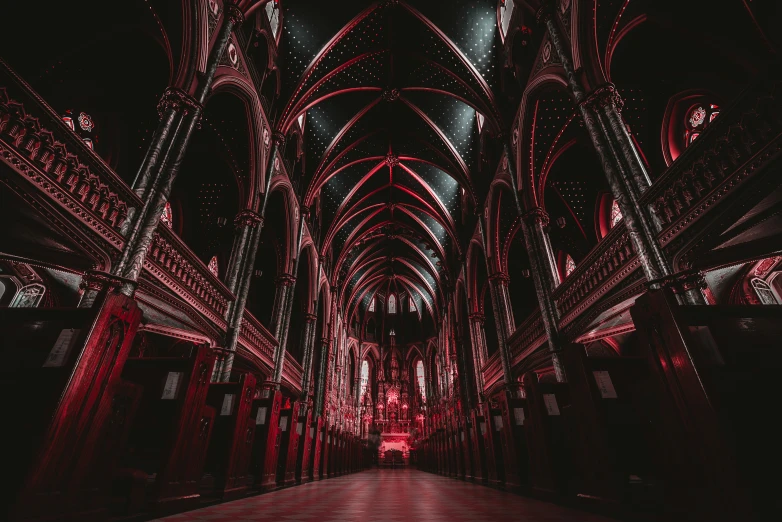 a building with many arches and red lights