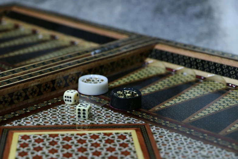 dices and dice pads set on ornately designed table