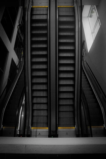 an escalator in a public transportation station with several passengers