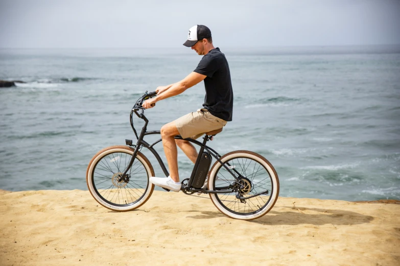 man riding his bike at the edge of the cliff