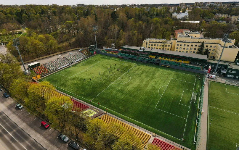 an aerial view of a sports field in the middle of town