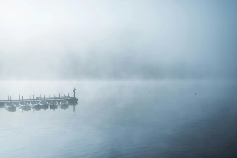 dock with many boats in the middle of the water