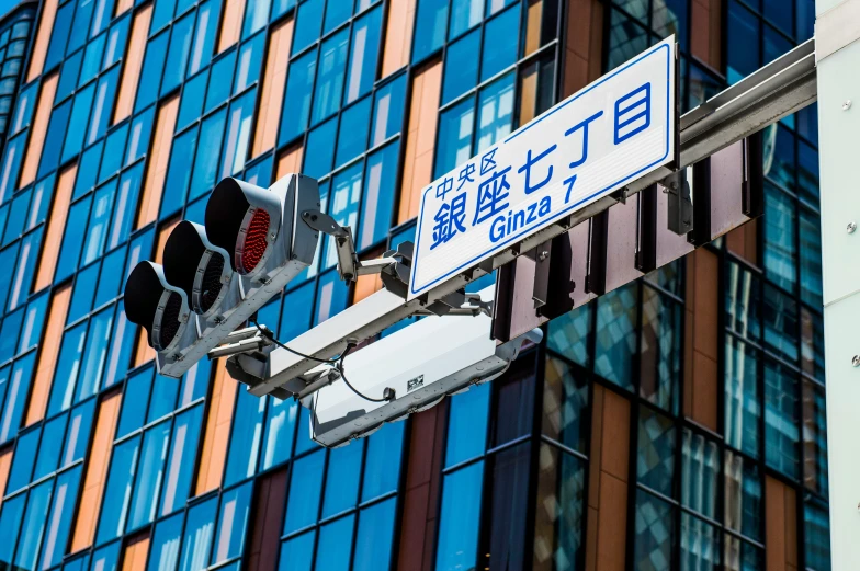 a close up of the street signs on the street pole