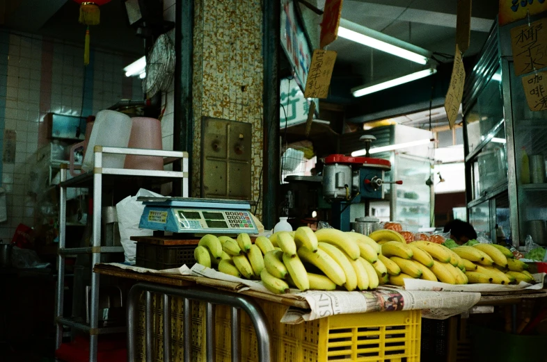 a bunch of bananas sitting in a banana stand