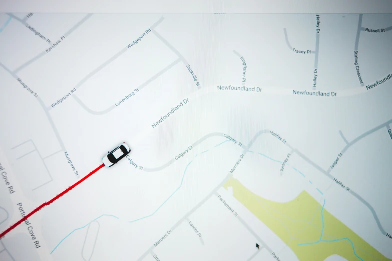 a gps device is seen on a map with red marker