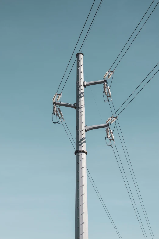 electrical wires with blue sky as background