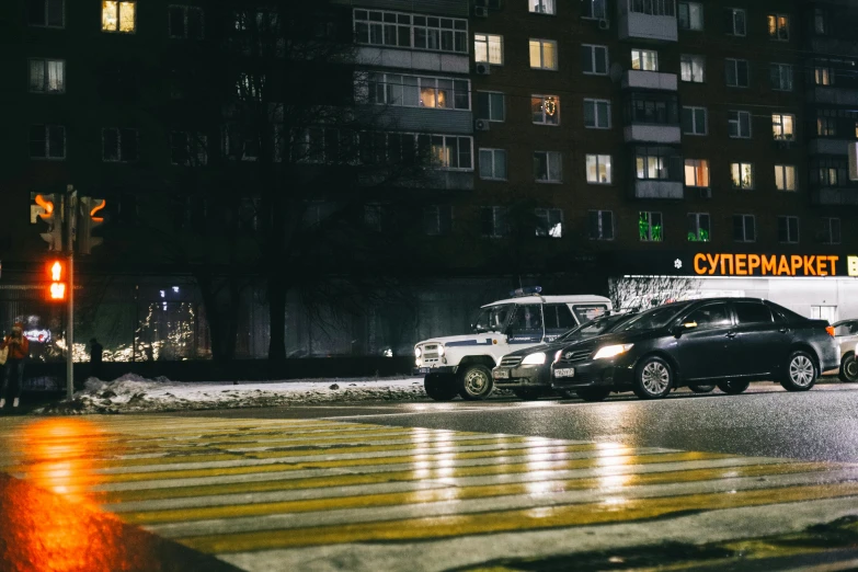 the truck and suv are sitting on the street