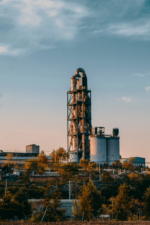 two stacks of metal structures near the town