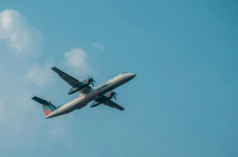 an airplane flying in a cloud filled sky