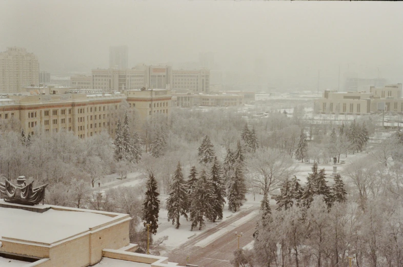 an aerial view of snowy town in the foreground