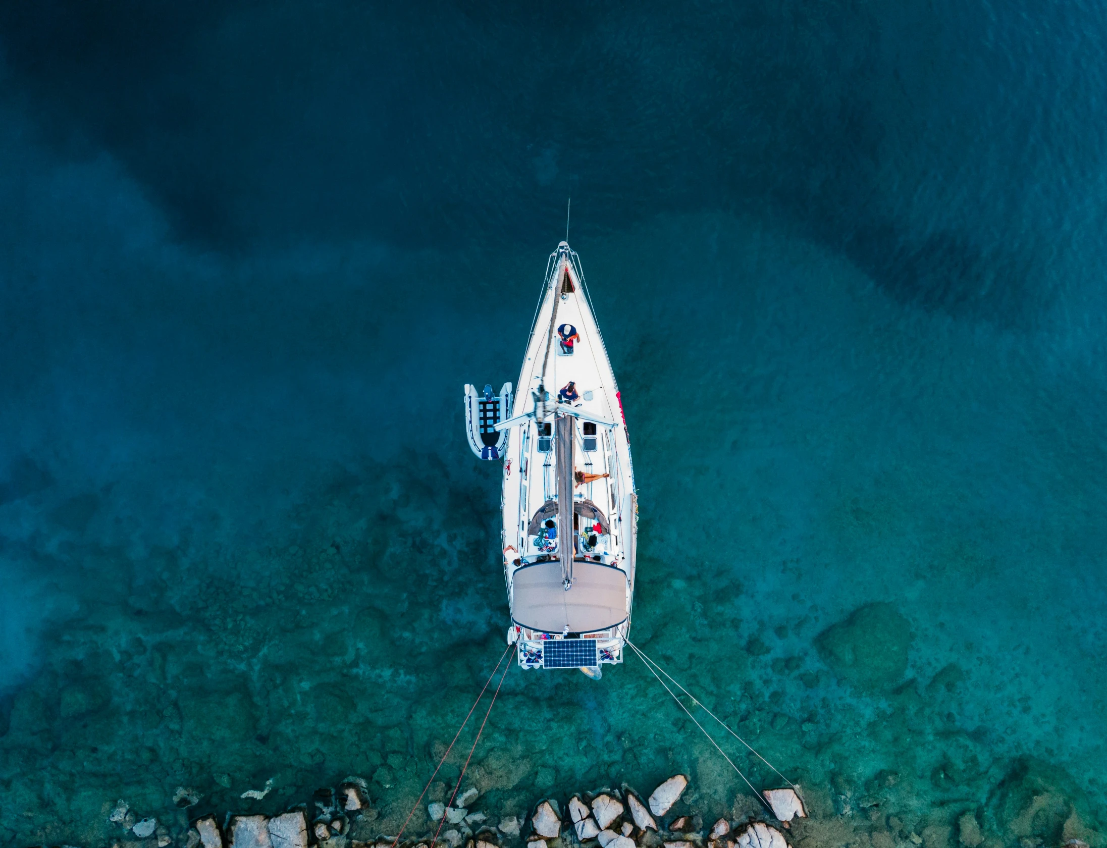 an aerial view of a boat in the water