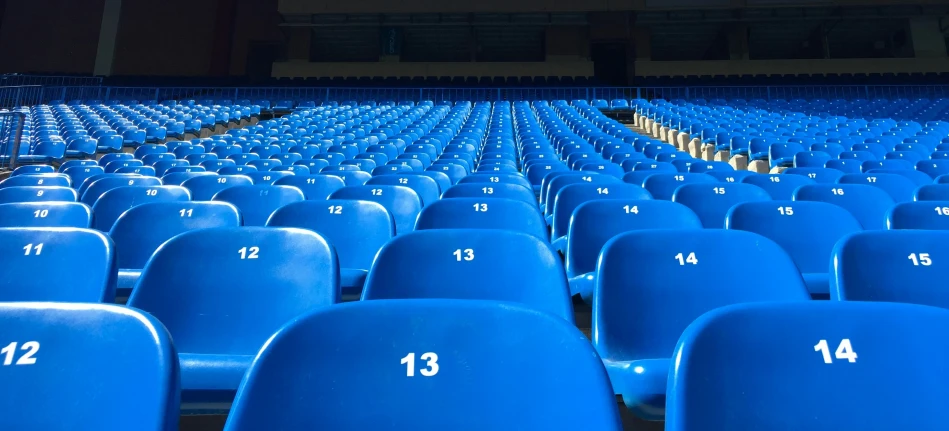 a po of some blue seats and numbers