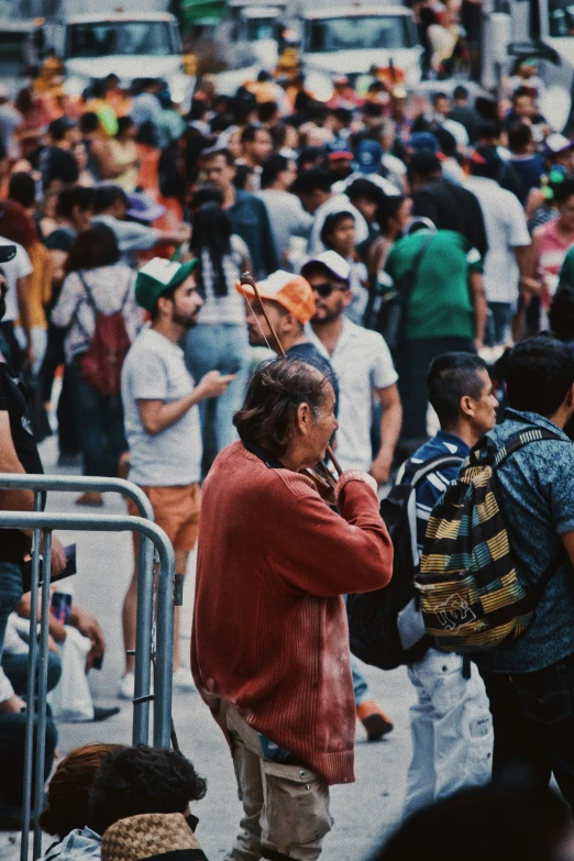 many people on the street in front of buildings