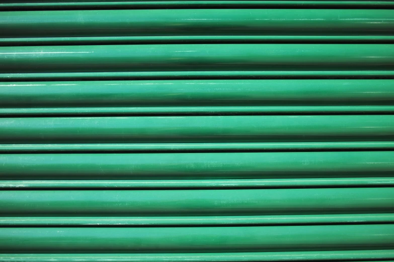green plastic slats are arranged together in rows