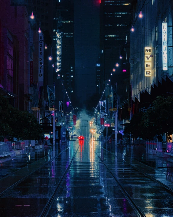 a rainy city street at night with traffic lights