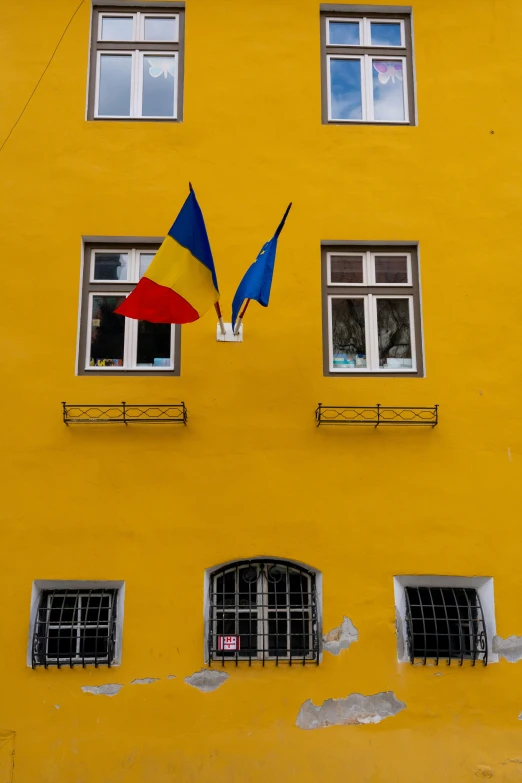 an upside down umbrella on the side of a building