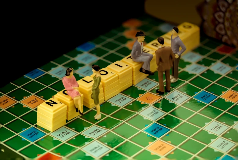 some people are playing scrabble game on a table