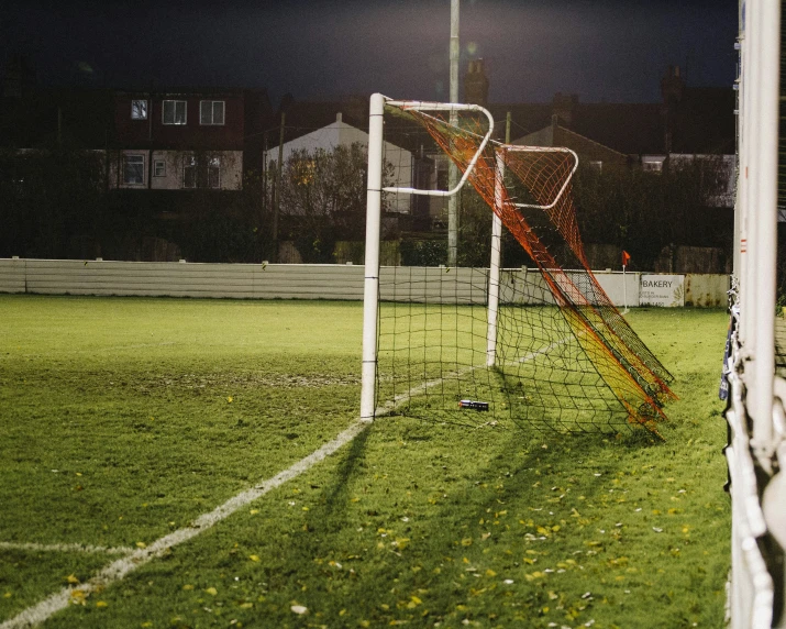 there is a soccer goal with a net by it