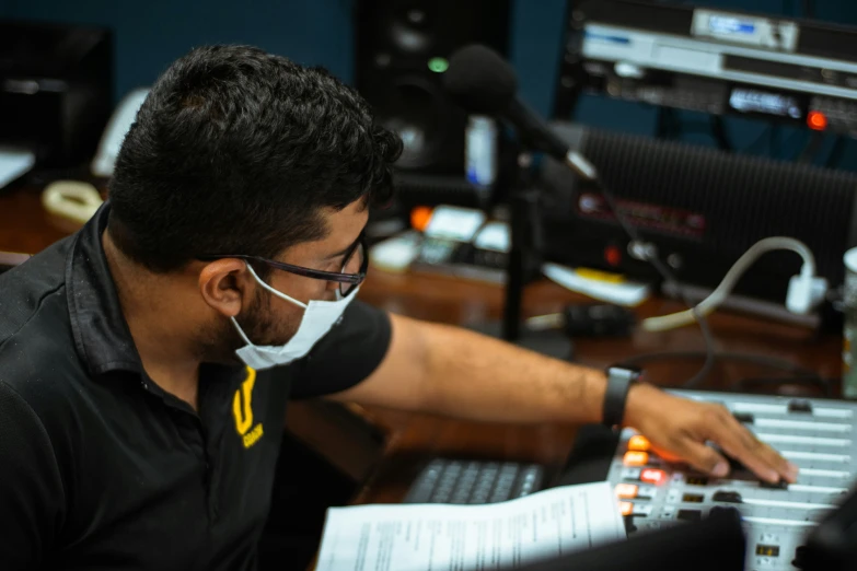 a person in front of some electronic equipment