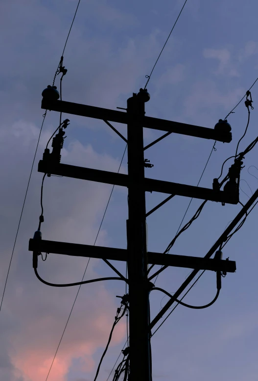 an image of multiple electric wires on an electrical pole