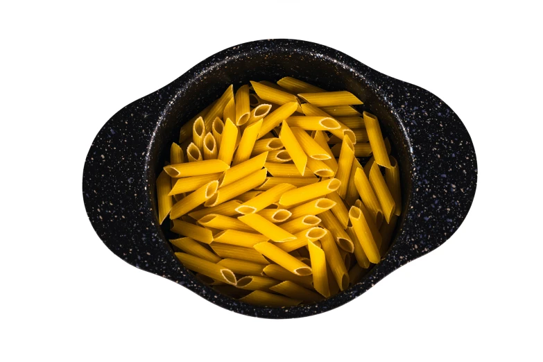 a bowl filled with yellow pennette next to an opened container