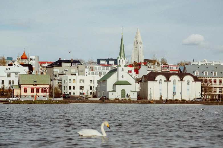 a view from the lake of some beautiful buildings