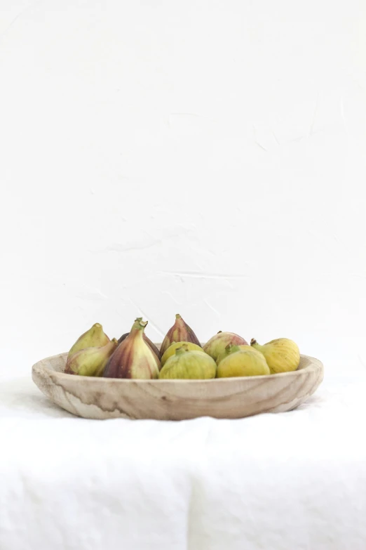 some fruit on a plate with a white background