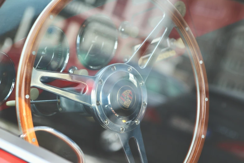 the inside view of a classic car, showing its steering wheel