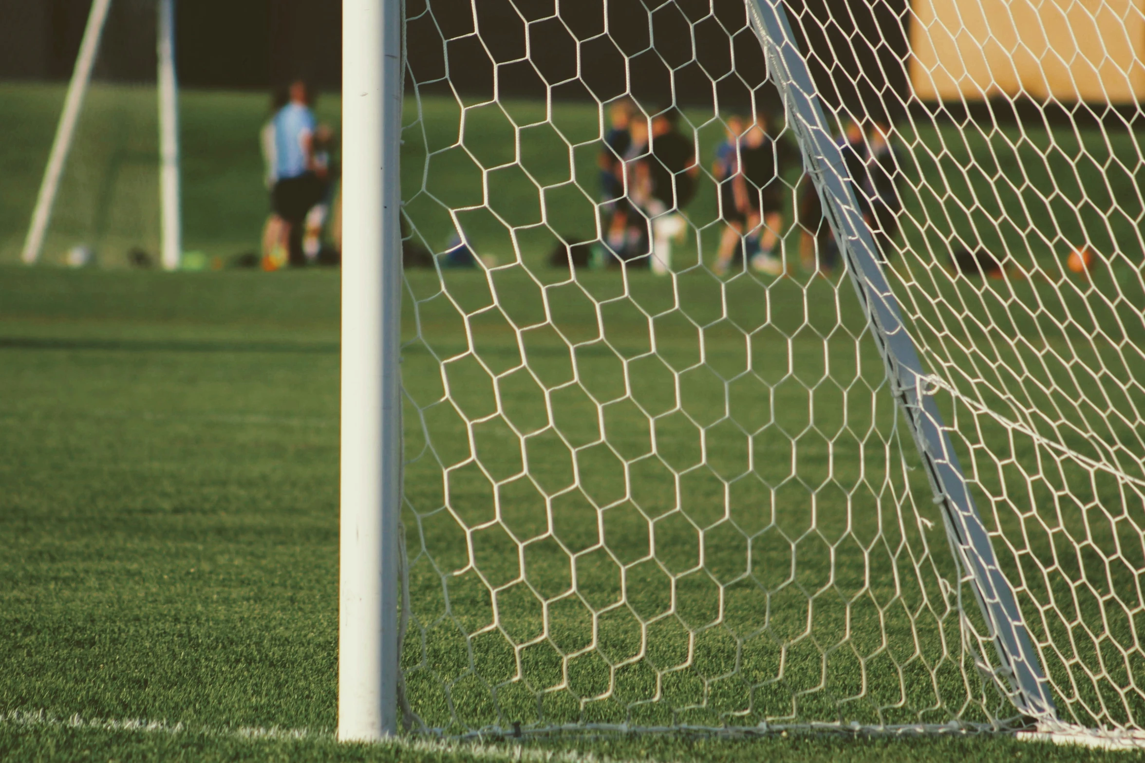 a soccer goal on the field, during a game