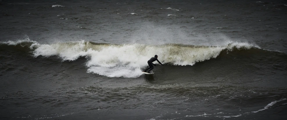 a man is on his surf board riding the waves