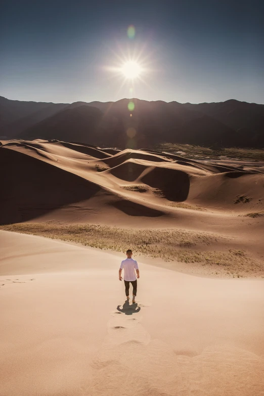 person standing on a skateboard in the desert