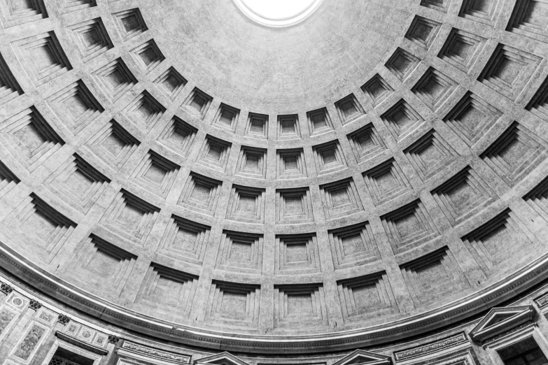 a circular hole in the ceiling that has windows