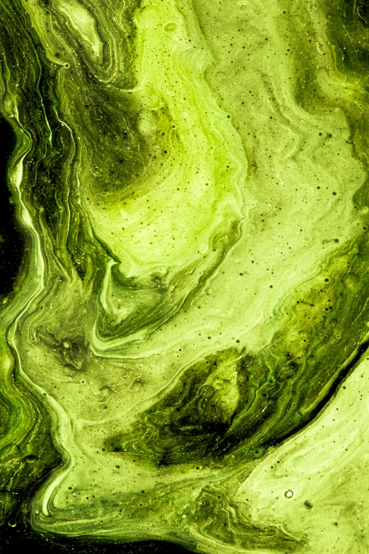 green swirling liquid that has been colored on to it