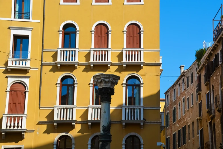 the windows on this building are red and yellow