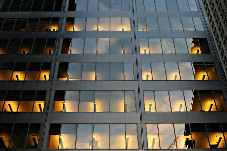 an office building that is reflecting its lights