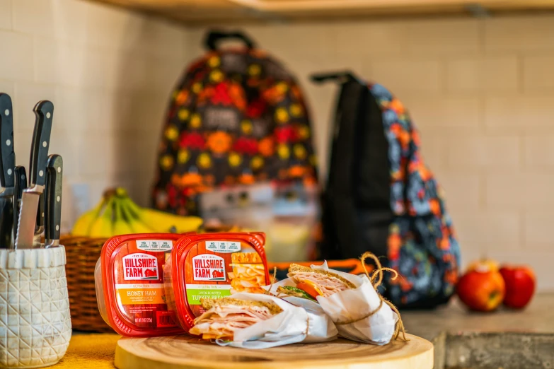 a lunch bag and some snacks on a table