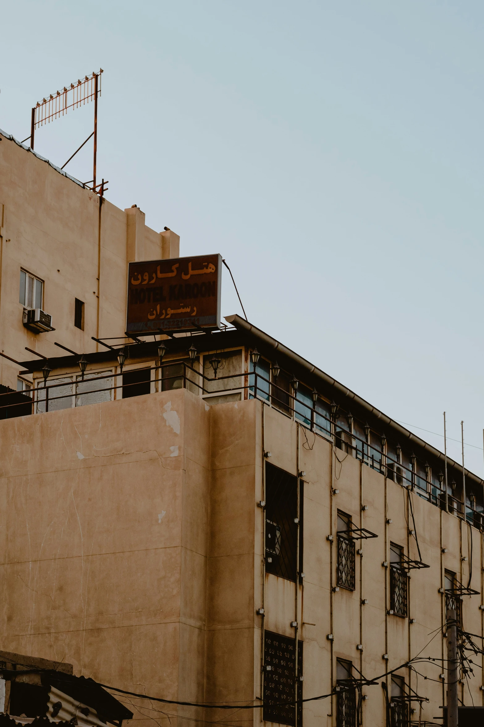 an old building has a sign on top of it