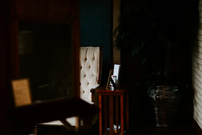 some items are sitting on a wooden stand next to a white brick wall