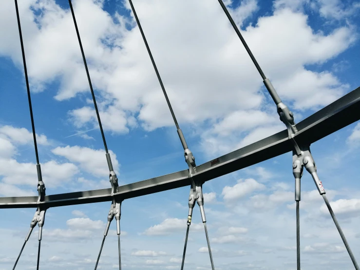 the view from inside a sail boat's rig, through the lines