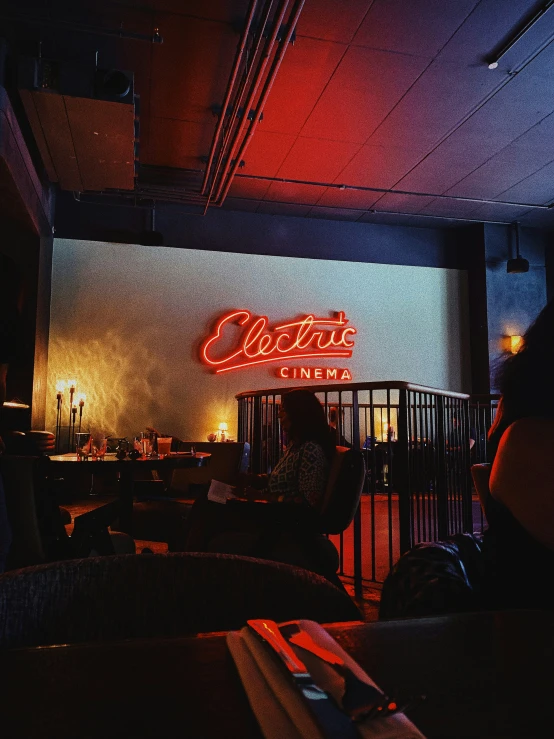 a bar with lots of chairs next to the bar