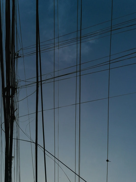 a power pole is seen against the sky