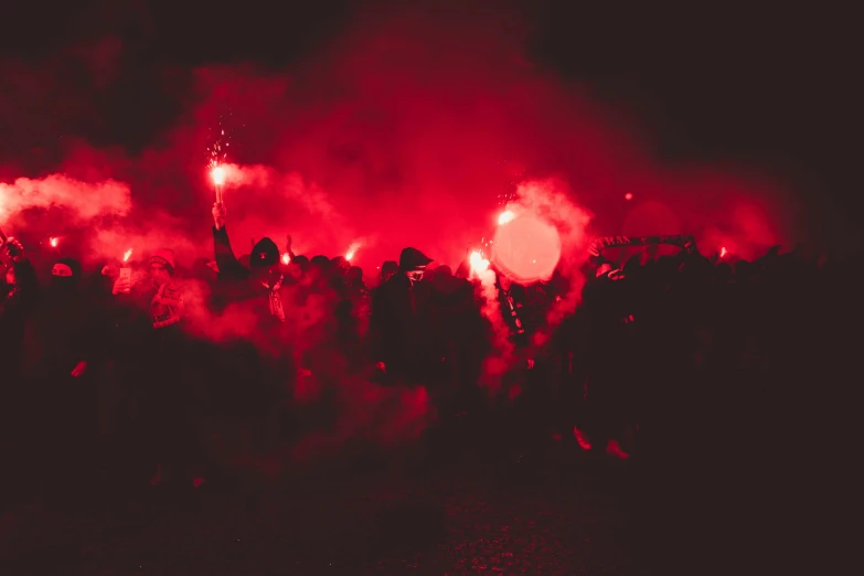 fireworks are burning in the dark of a field