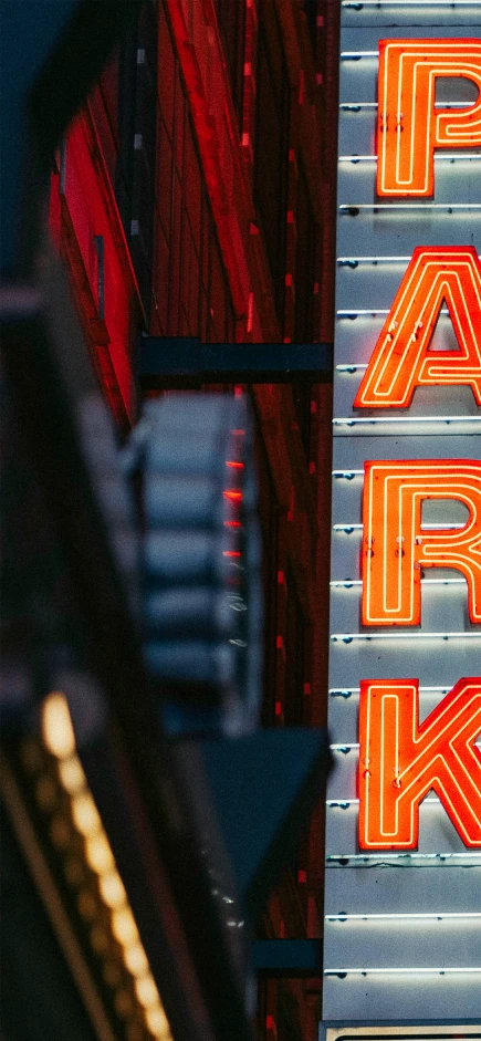 the neon sign for park drive is shown at night