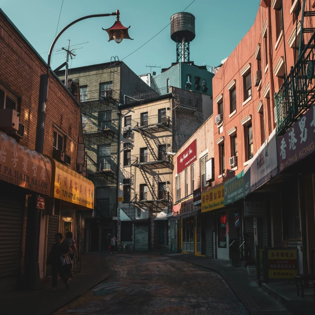 a street with lots of tall buildings and traffic lights