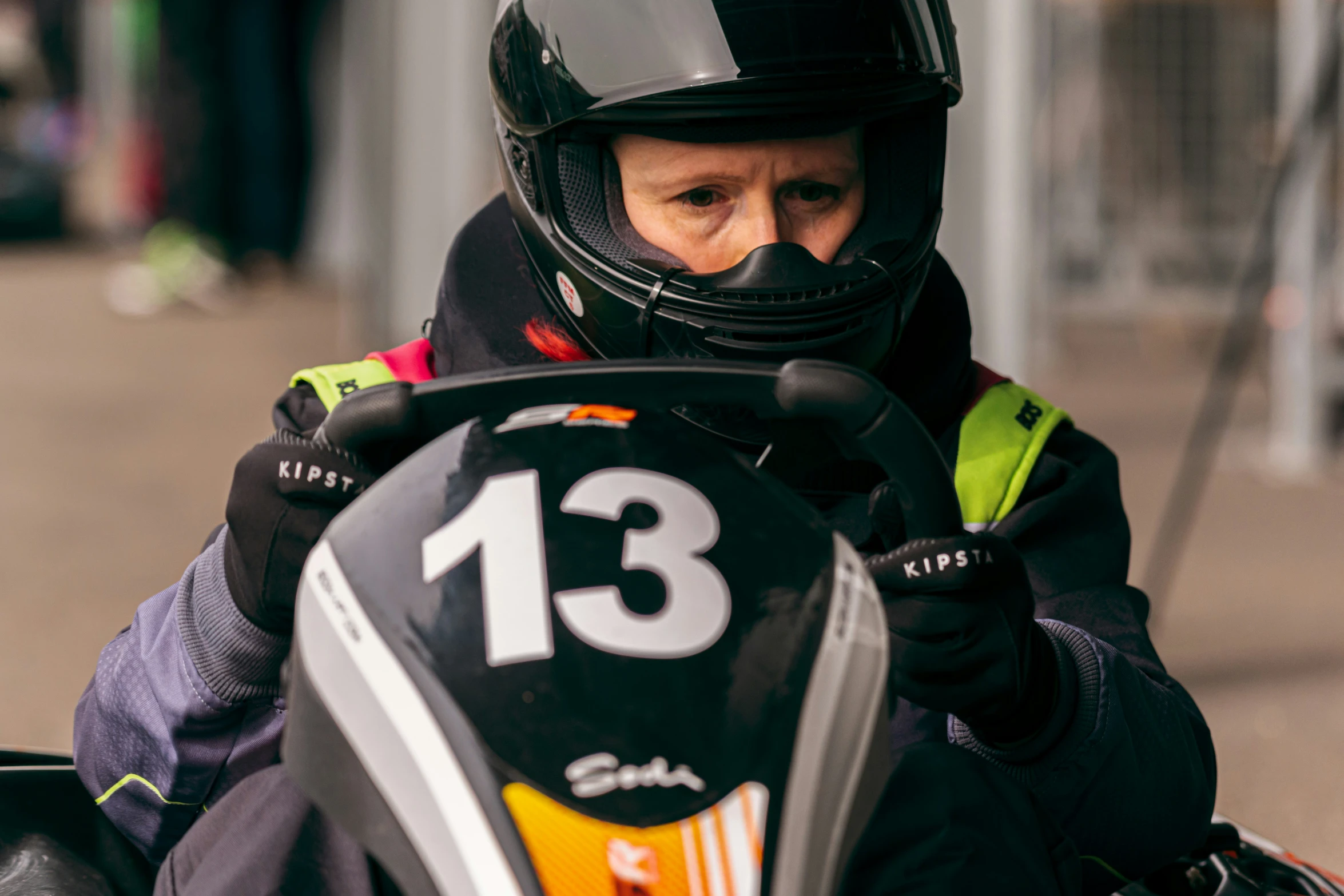 a close up of a person in a racing car