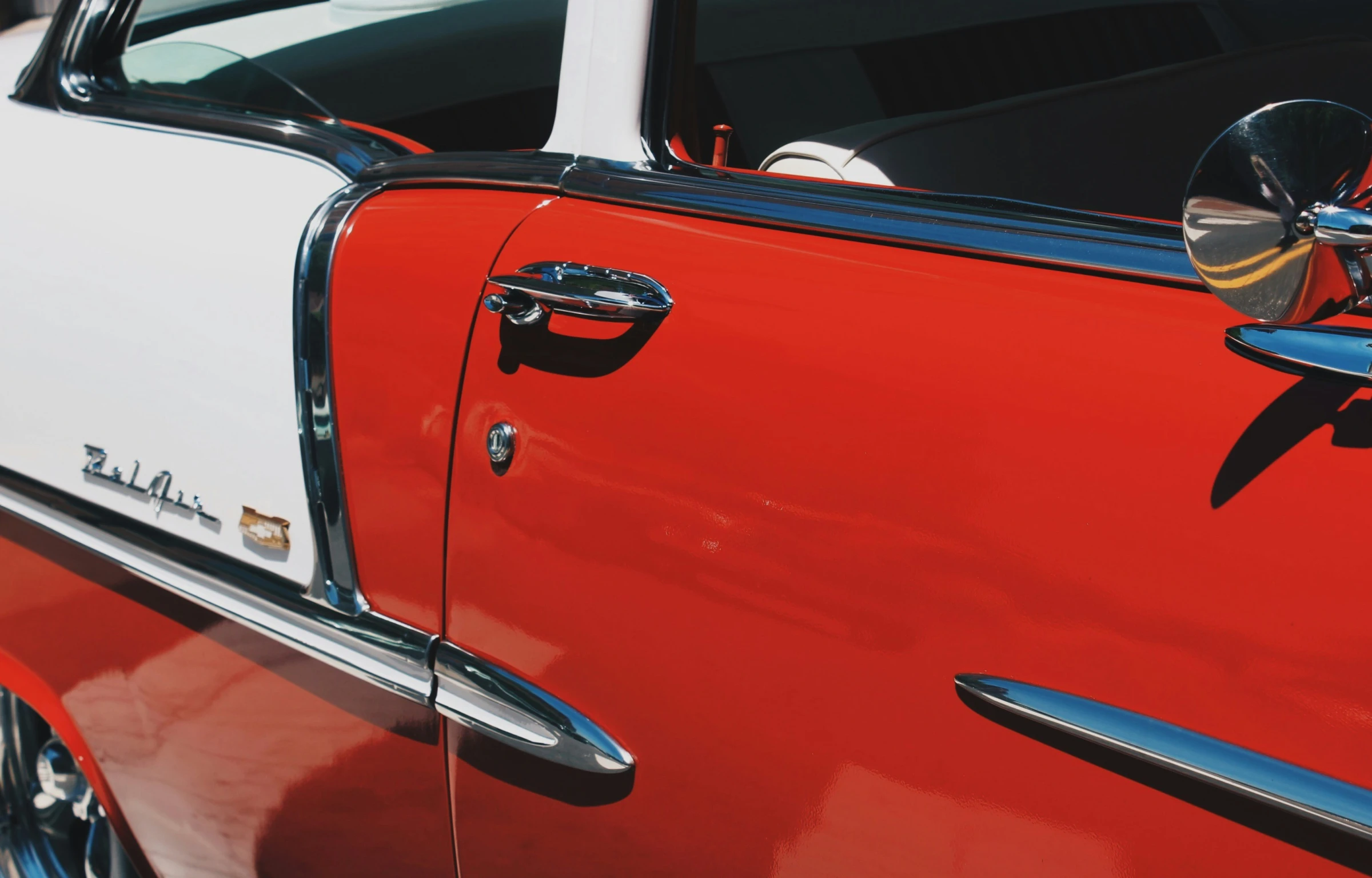 a closeup view of a classic red and white vehicle