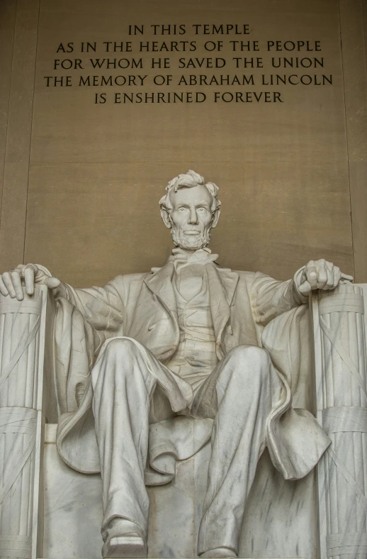 lincoln memorial with an american poem written above it