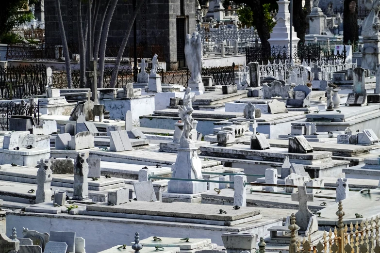 several cemetery graves next to an old city street