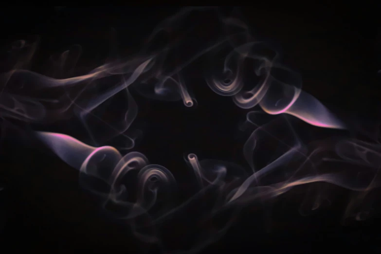 smoke comes out of the center of a black background